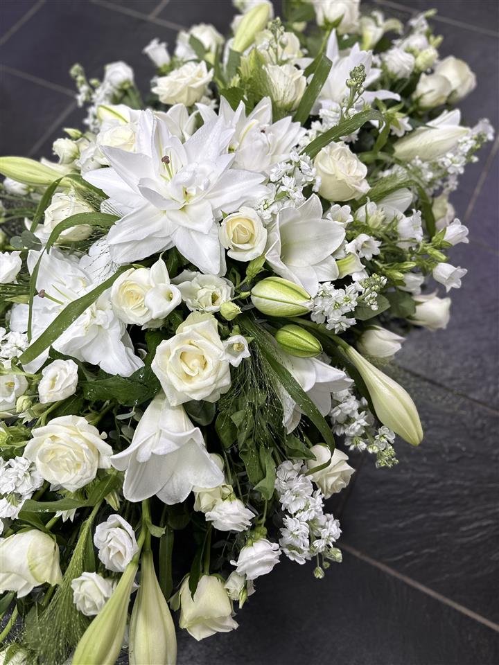 Sympathy funeral flowers Cornwall casket spray Helston